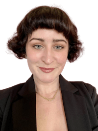 a woman in a black jacket with short hair